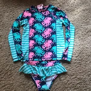 NWT. Ruffle Girl rash guard suit. Size 8.